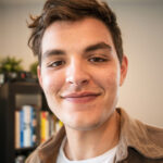 negative space smiling young millenial businessman 1536x1024